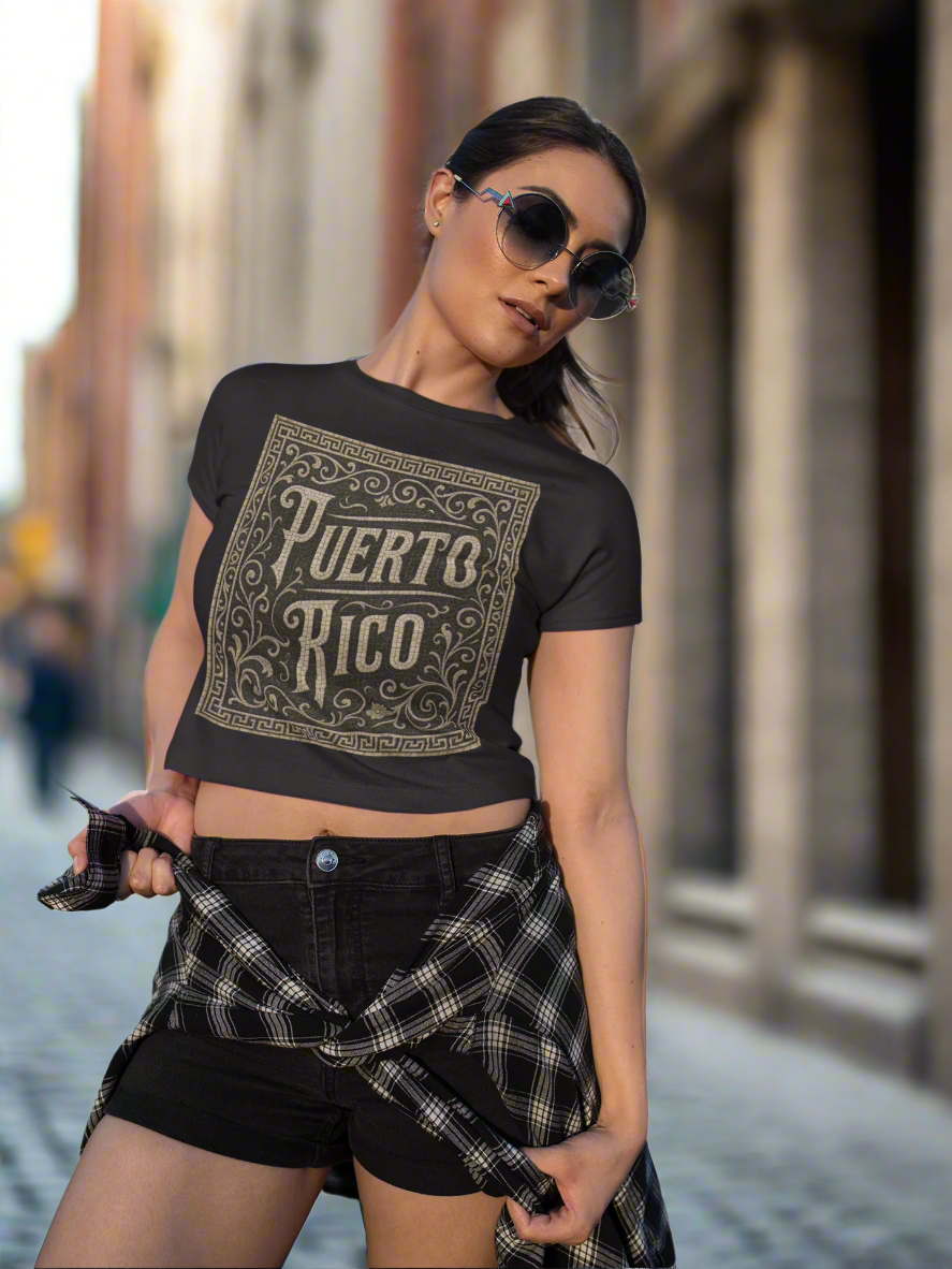 Woman wearing a black crop top with 'Puerto Rico' print and plaid shorts on a white background