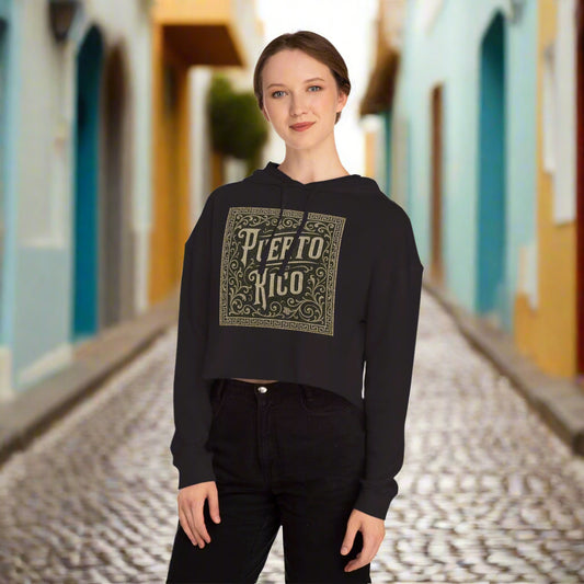 Person wearing a black Puerto Rico hoodie with decorative text design in Old San Juan